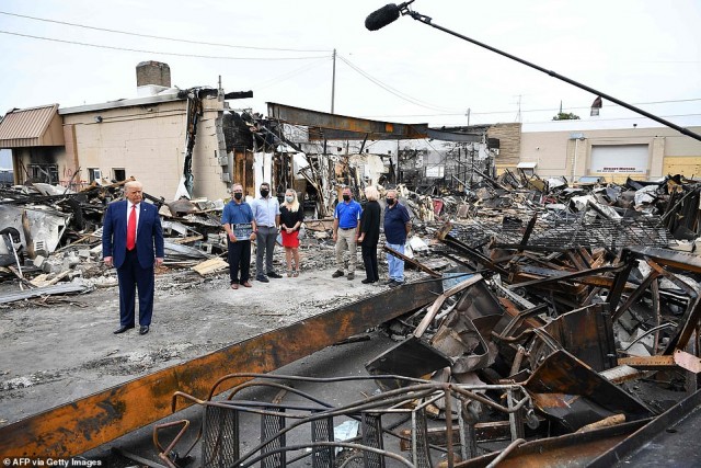 32656752-8686693-President_Trump_surveys_damage_in_Kenosha_Wisconsin_Tuesday_in_t-a-46_1598994450744.jpg